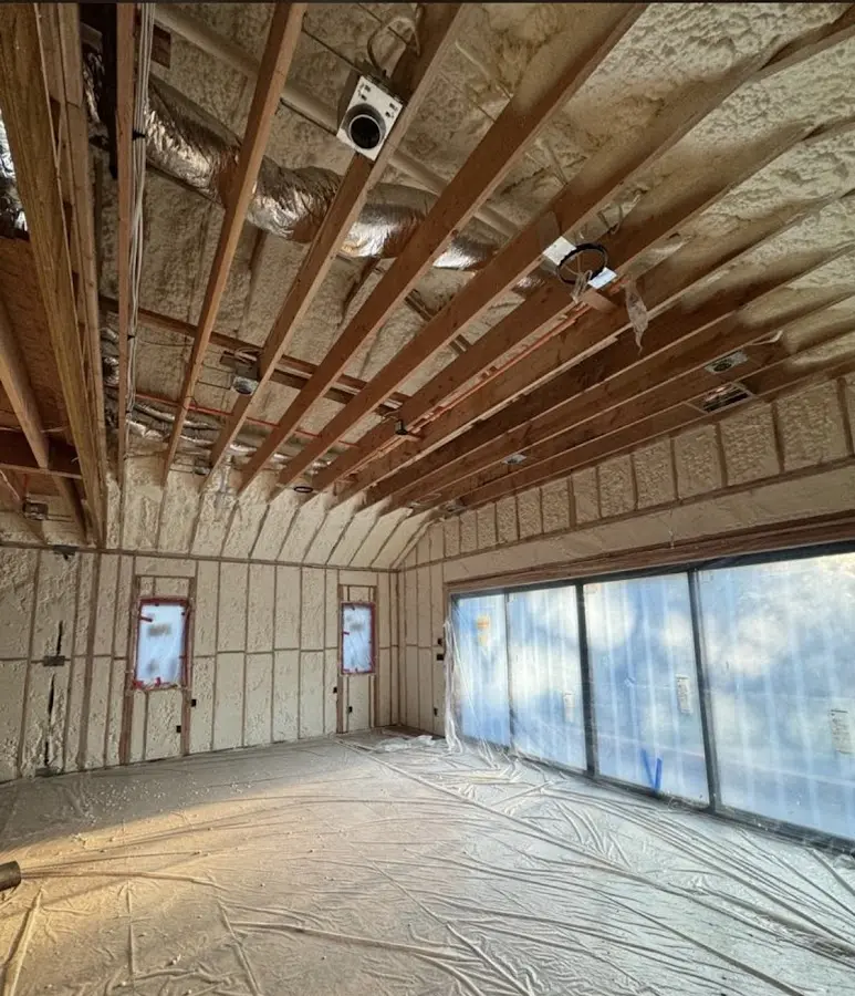 Interior walls and ceiling insulated with spray foam during new construction in New Franklin